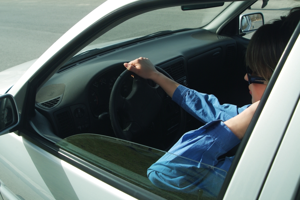 Woman Talking on Cell Phone in Car