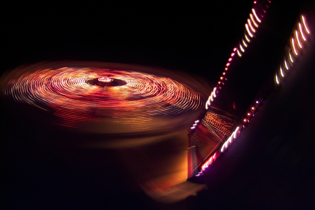 Amusement Park Ride with Colorful Lights at Night