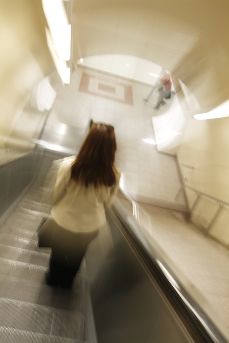 Woman on The Escalator