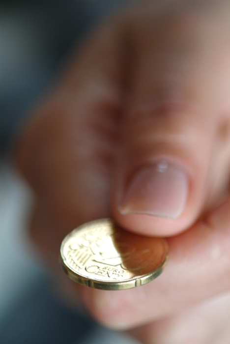 Hand Holding Euro Coin