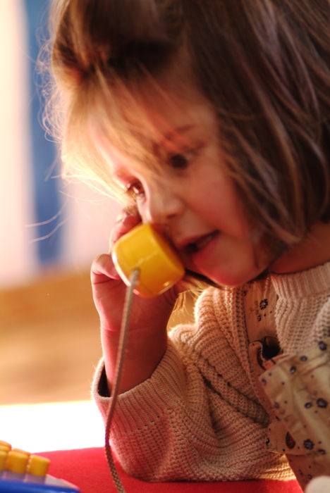 Young Girl with Play Telephone
