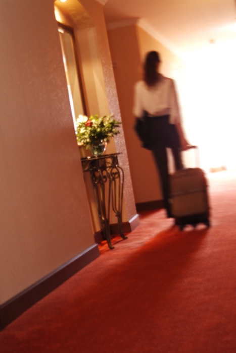 Businesswoman Leaving Hotel Room