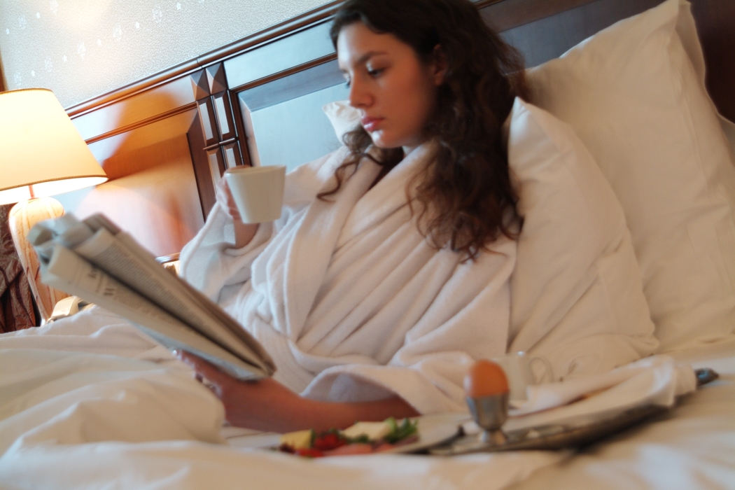 Woman Having Breakfast in Room