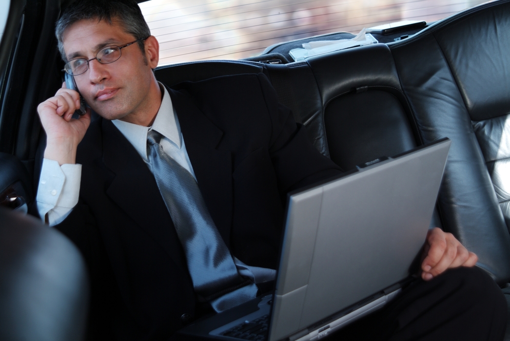 Man Talking on The Phone in a Limousine