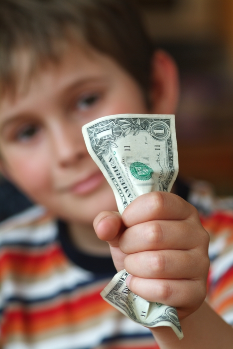 Boy Crumpling a Dollar Bill