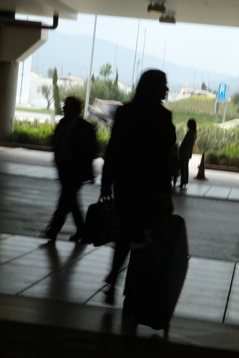 People Leaving The Airport