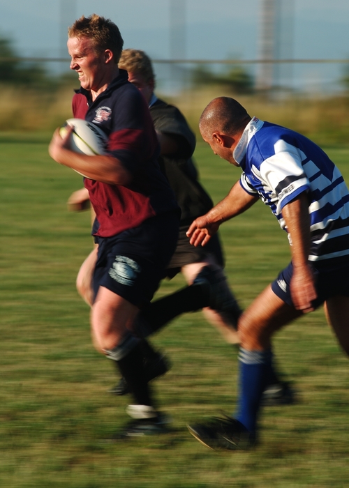 Rugby Player Running Hard with the Ball