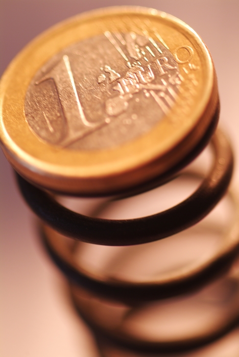 Financial Concept Euro Coin on Spring