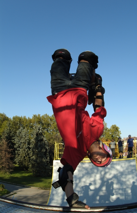 In-Line Skater Rollerblading a Half-Pipe