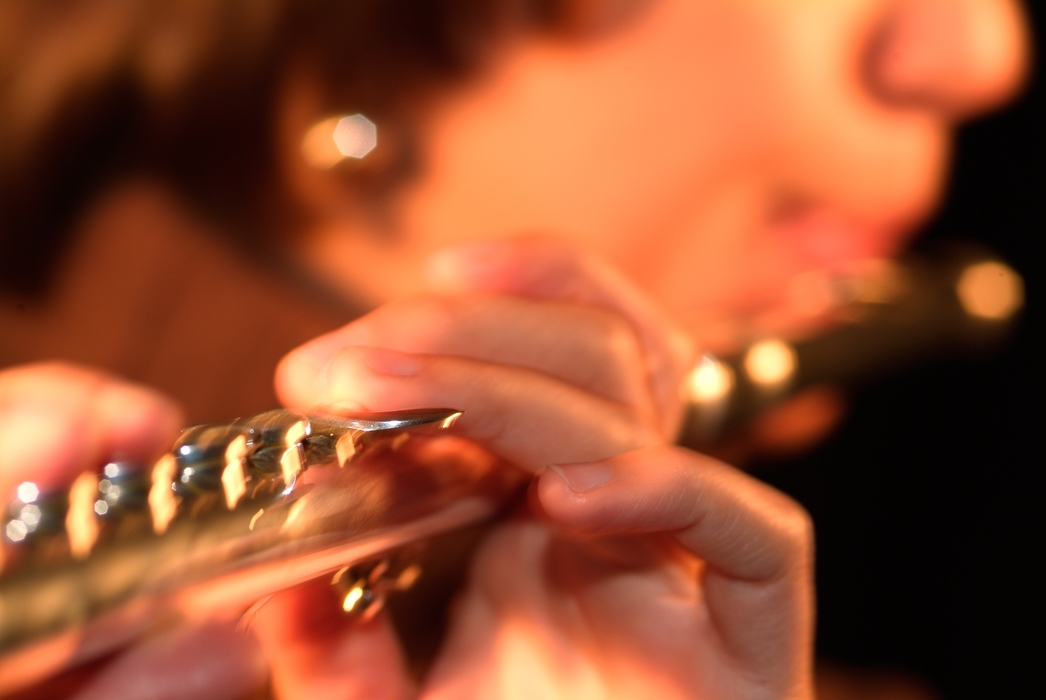 Symphony Orchestra Flutist Blows Through Lip Plate