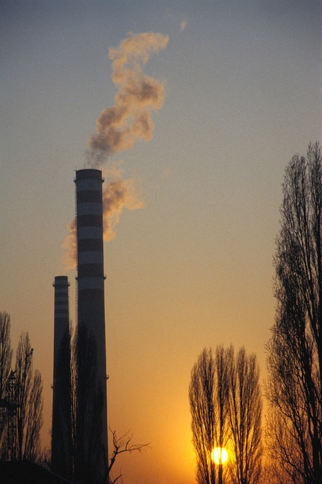 Factories and Refineries Belching Smoke in Sunset