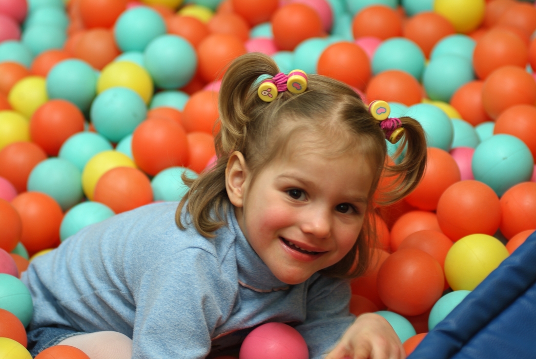 Girl Playing in Ball Room