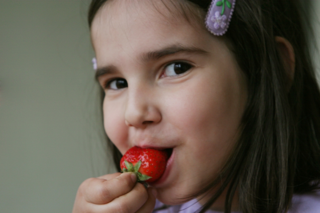 Girl Eating Strawberries