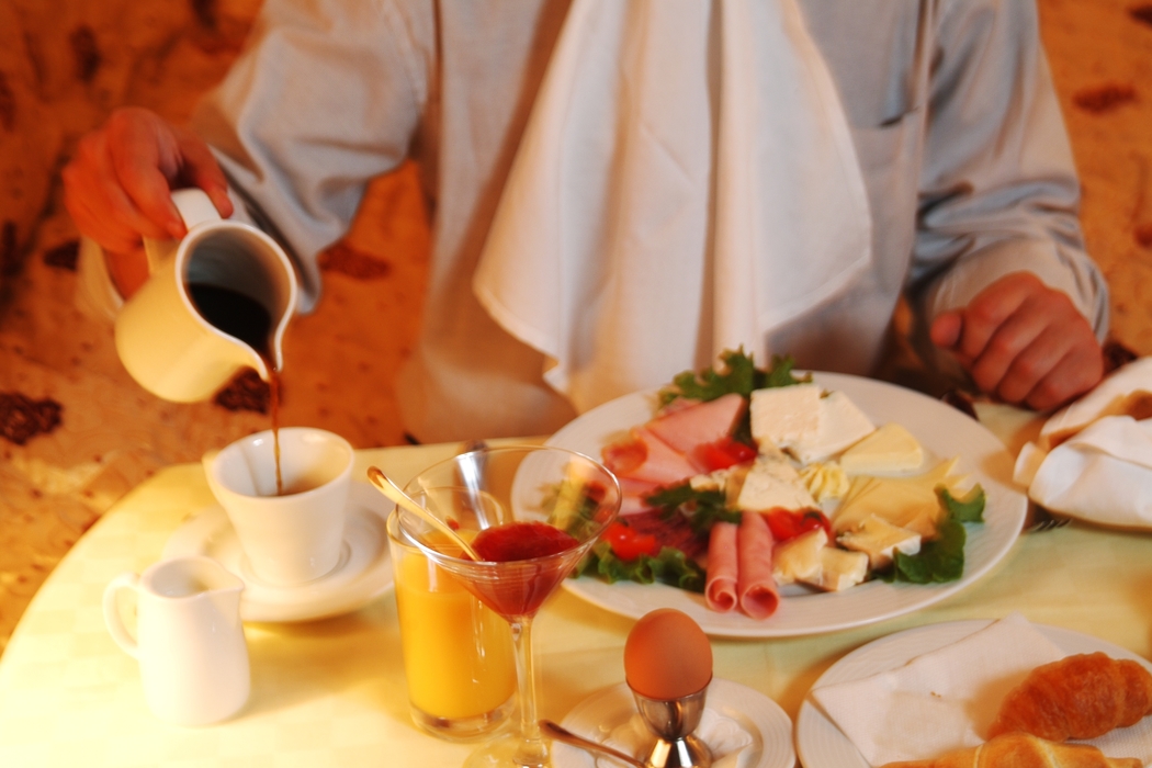 Businessman Eating Breakfast in Room