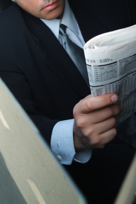 Businessmen Reading Newspaper