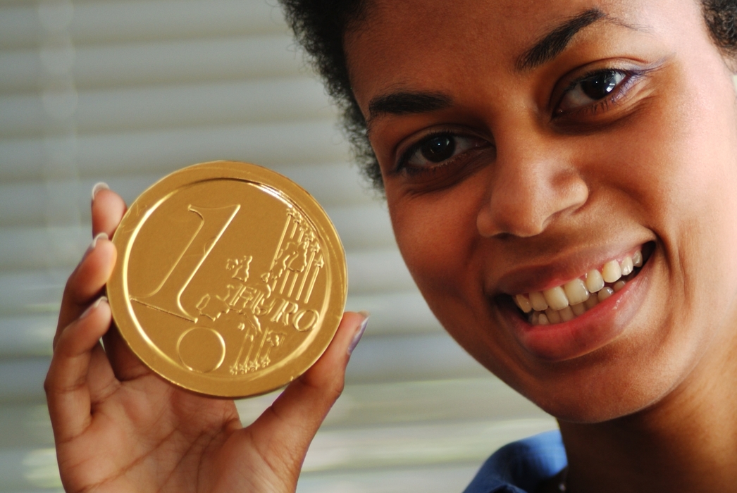 Woman Holding Euro Coin
