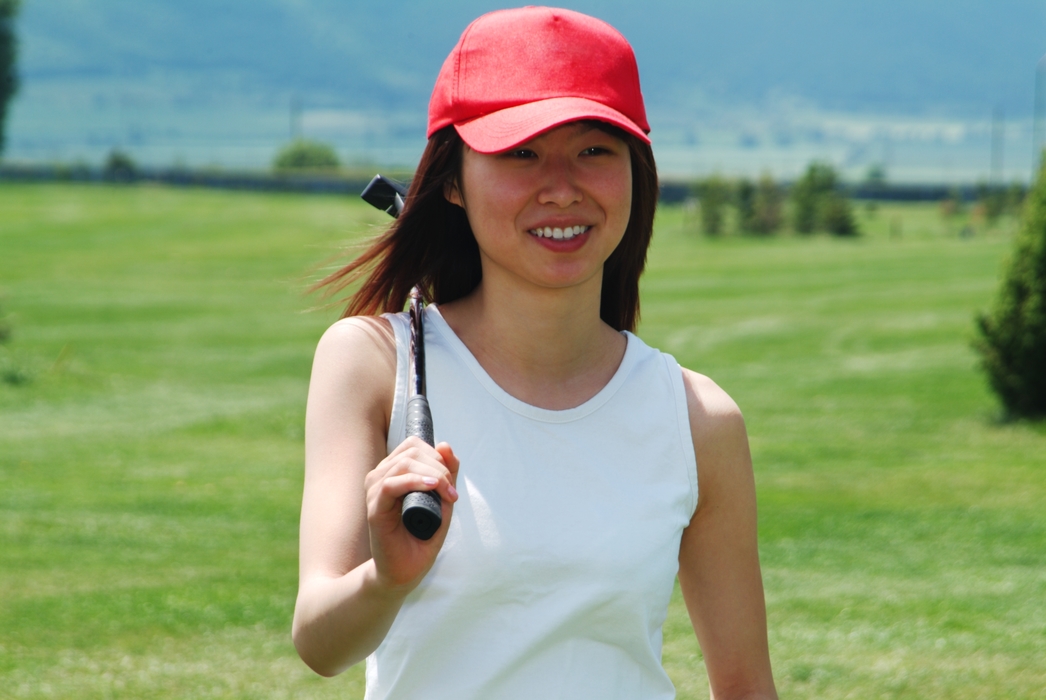 Female Golfer and Her Putter
