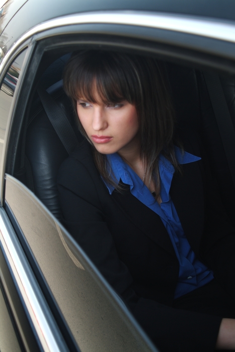 Businesswoman in a Limousine