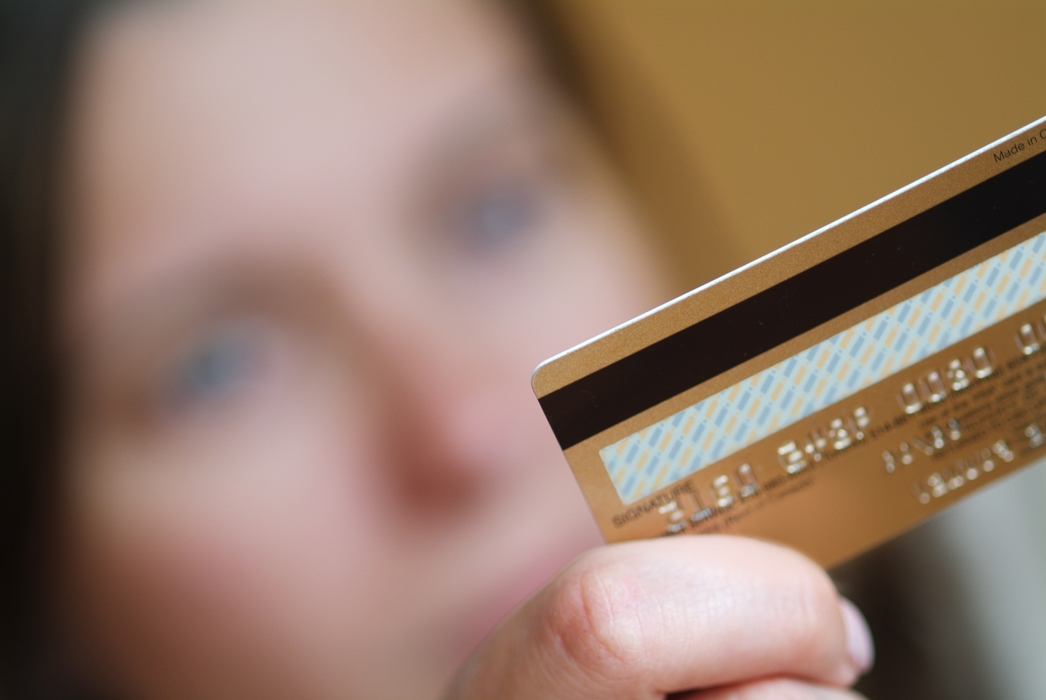 Woman Holding a Credit Card
