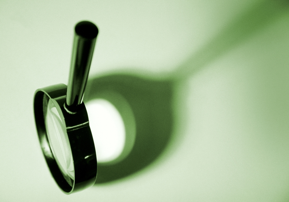 Magnifying Glass with Dramatic Shadow