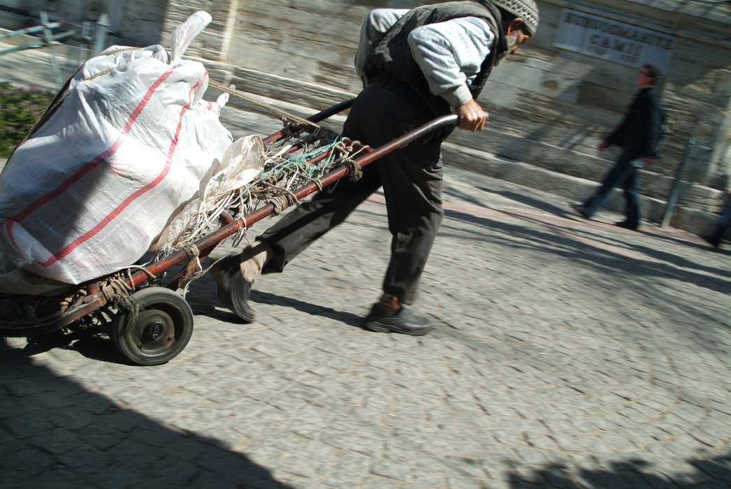 Street Worker Transporting Shipment