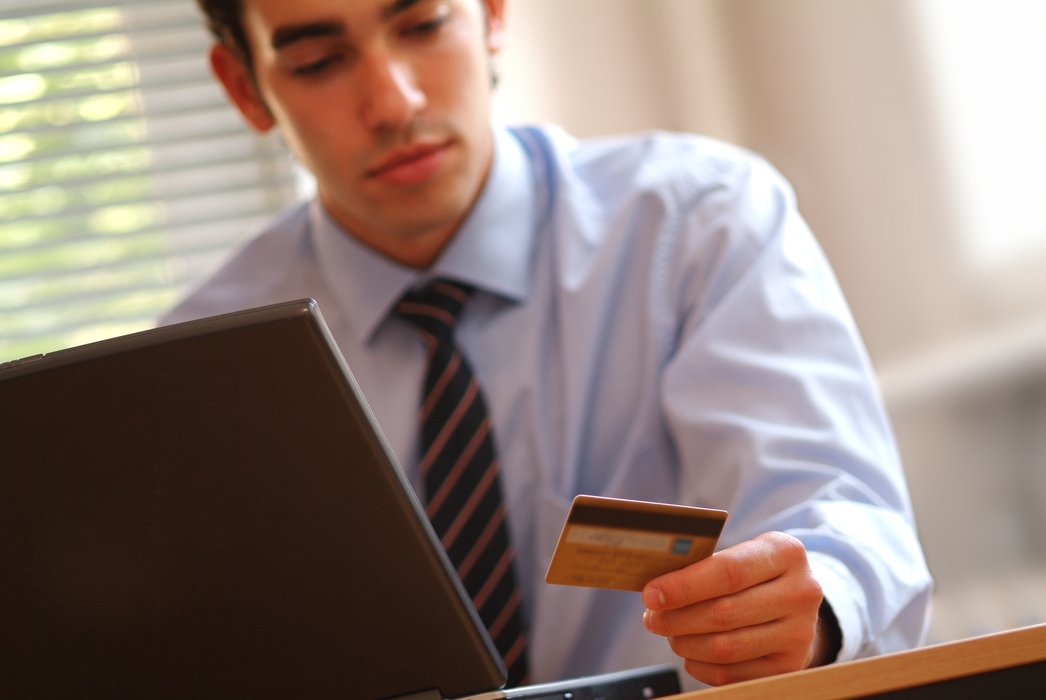 Businessman Making Online Transaction with Credit Card