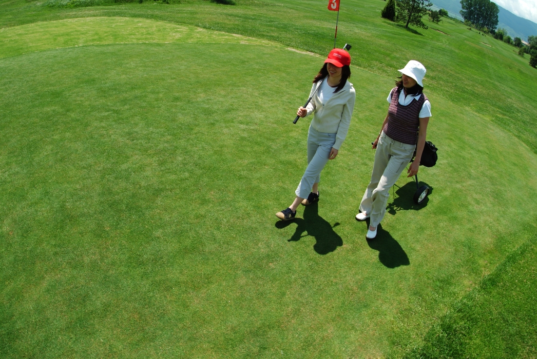 Female Golfers Walking to The Next Hole