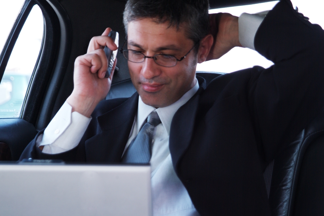 Man Talking on The Phone in a Limousine