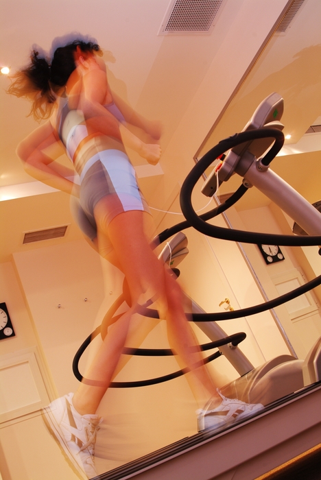 Woman Running on the Treadmill