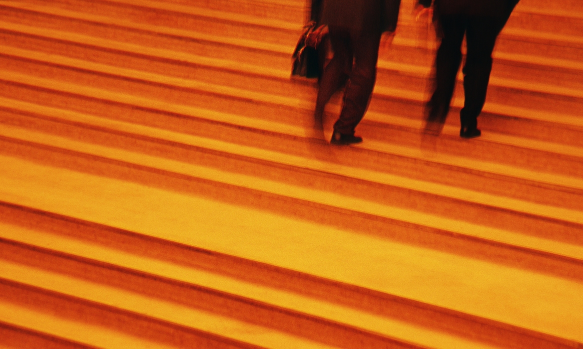 Business People Going Up Stairs