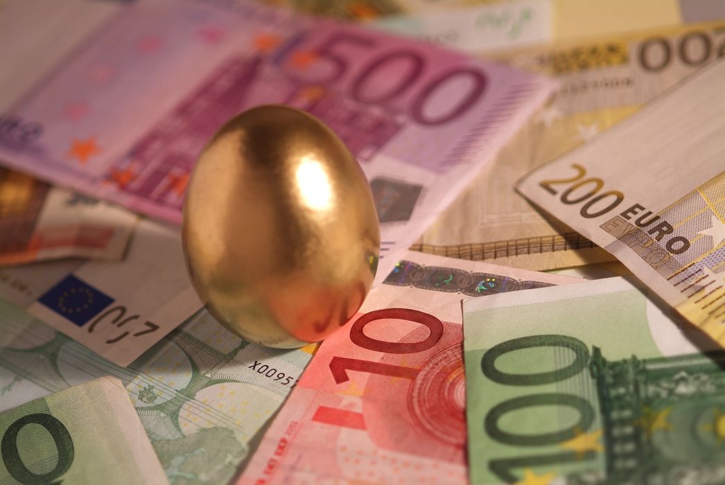 Financial Concept Golden Egg with Money