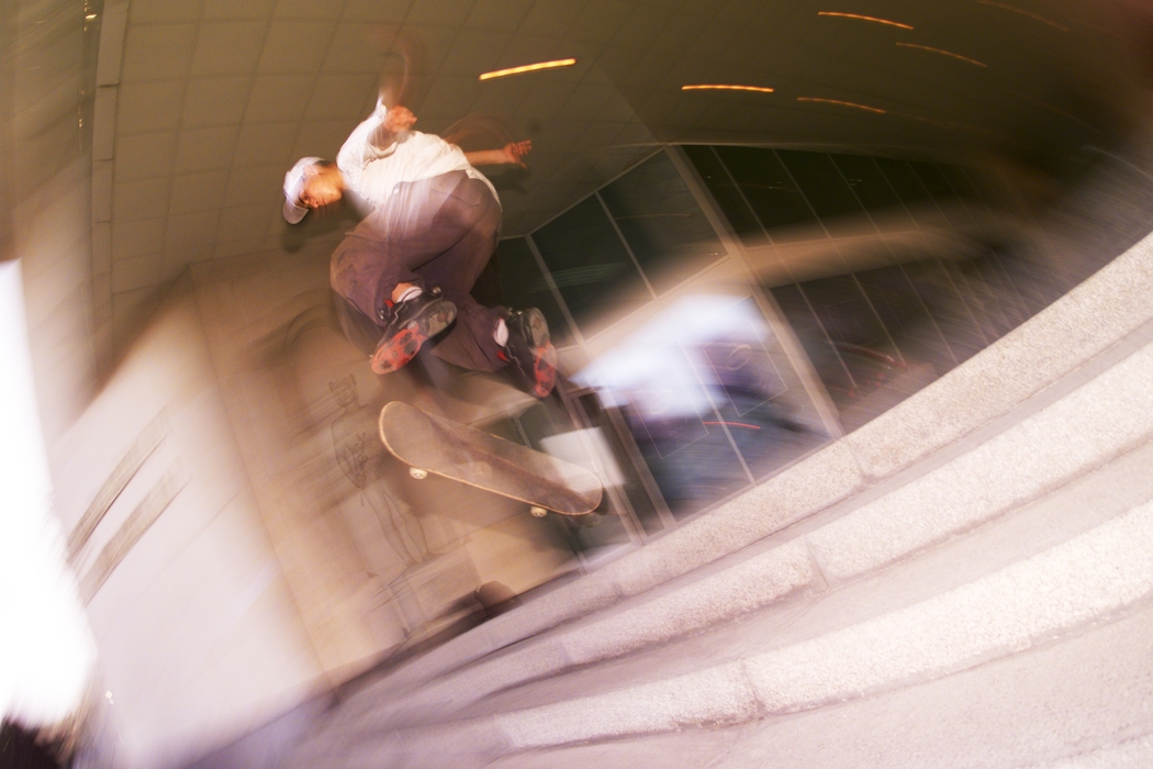 Skateboarder Jumps down Stairs