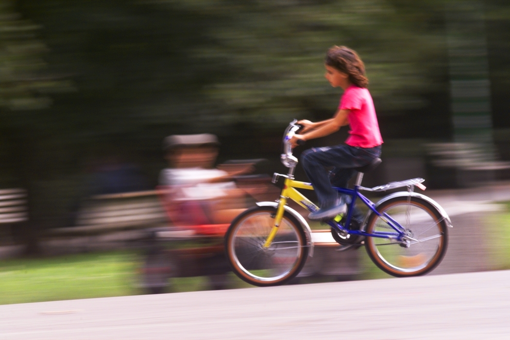 Girl Riding Bike in Park
