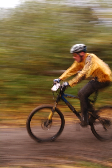 Cyclist Racing Hard in Mountain Bike Competition