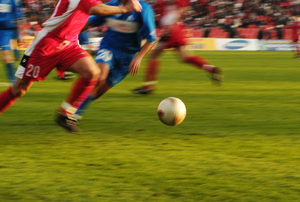 European Football: Soccer Player Race to the Ball