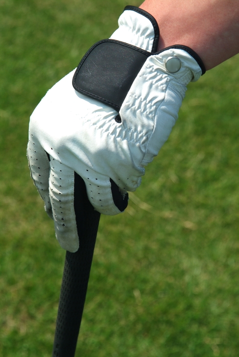 Golfer Resting on Club