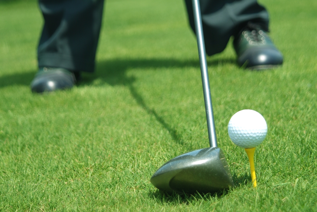 Golfer Teeing Off