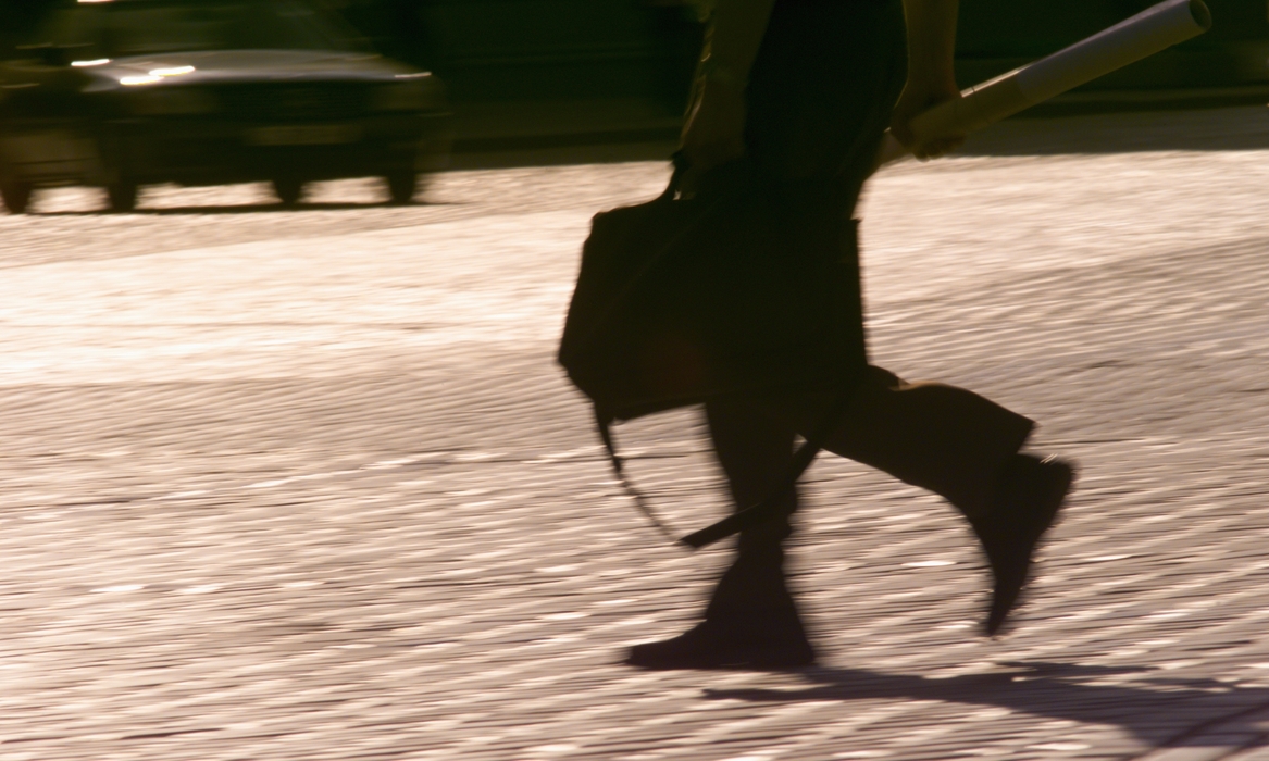 On The Move Man Crossing the Street