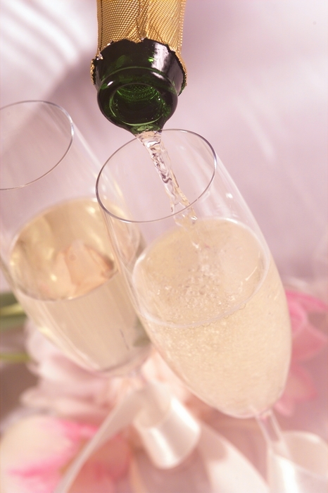 The Wedding Day:  Pouring Champagne into Glasses