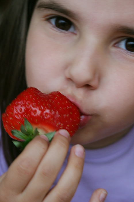 Girl Eating Strawberries