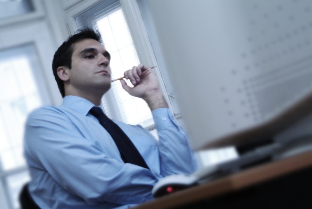 Businessman Relaxing At Desk