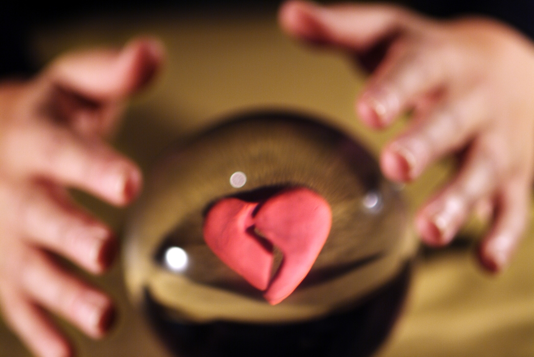 Hands and Crystal Ball with Broken Heart Inside