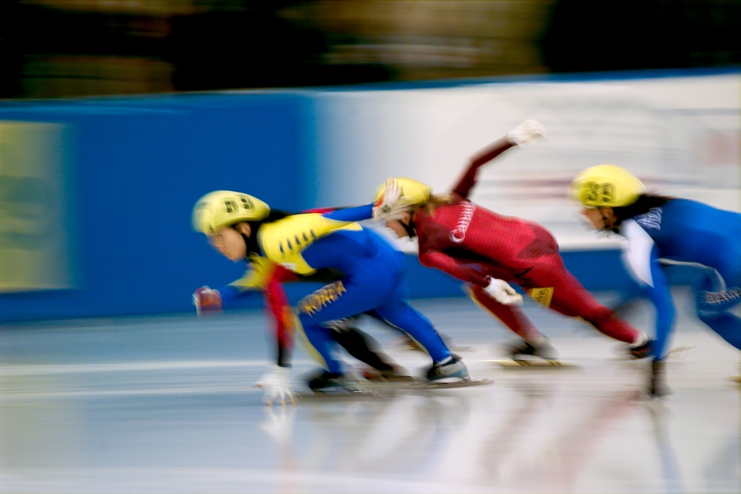 Speed Skaters Making a Turn