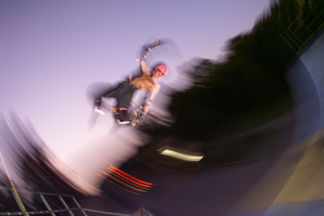 Skateboarder Rides the Half-Pipe