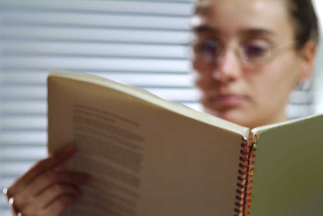 Businesswoman Reading Through Documents