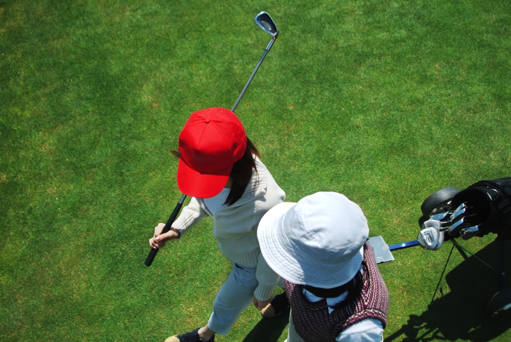 Female Golfers Walking to The Next Hole