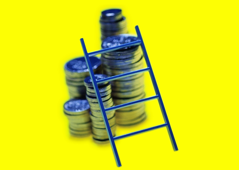 Small Ladder Leaning Against Stacks of Coins