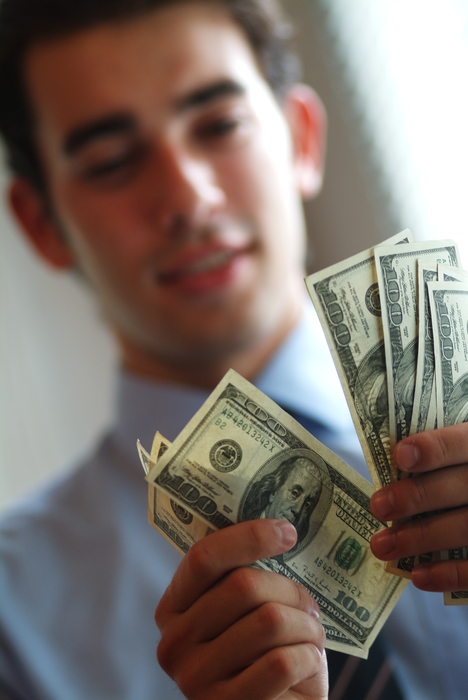 Man Counting U.S. One Hundred Dollar Money Bills