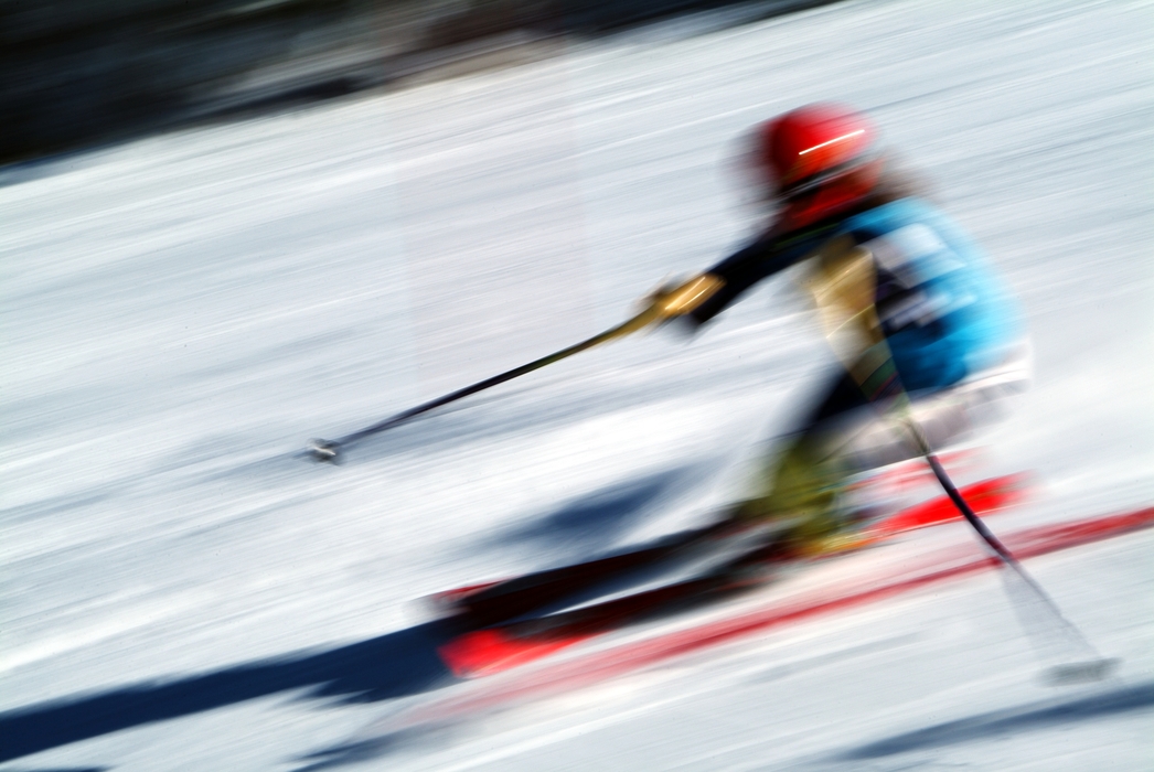 Downhill Skier Passes a Gate During Race