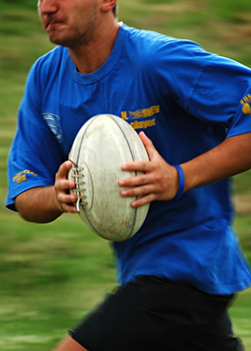 Rugby Player Gets the Ball
